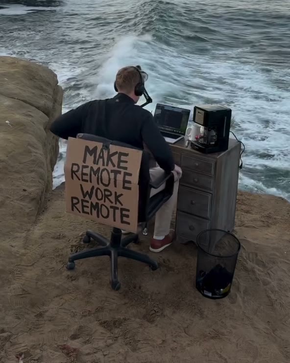 Scotty at his desk on the edge of Sunset Cliffs above the surf